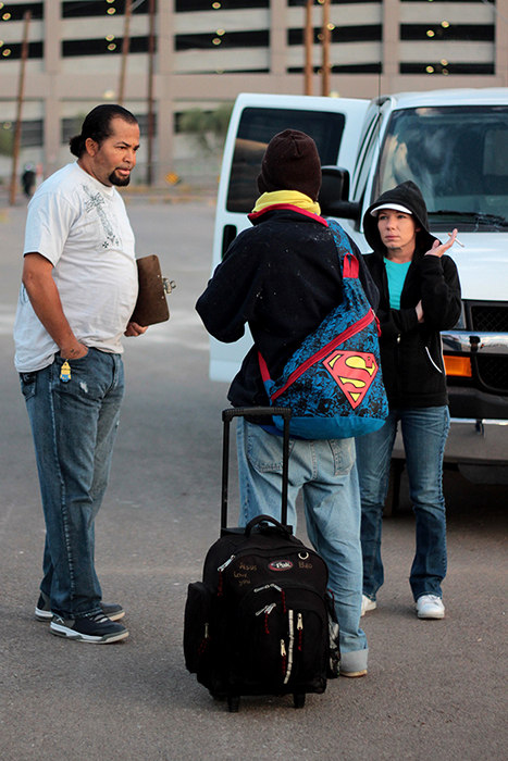 Bennett and Felty are helping a Vietenesse man during their routine community outreach on Nov. 17.  They encounter many internationally displaced people who do not understand how to get help and often get lost in the system. Photo by Alexis Macklin